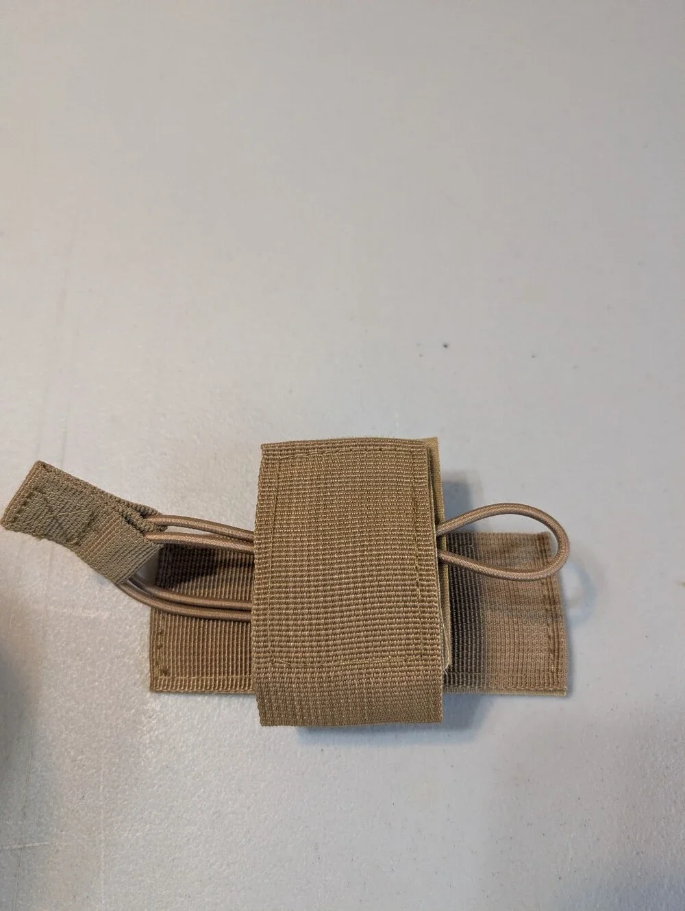 New tan tactical sling pack with holster